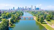 © Cdel - Aerial view of Denver cityscape showcasing bridges over Cherry Creek River, vibrant urban landscape, expansive skyline, dynamic architecture, serene waterways