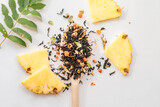 Creative composition with variety kinds of tea, grapefruit, banana, ananas and other accessories for making tea