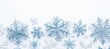 © Kamil - Snowflake border on white winter background