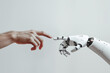 © Imagination Stock - A white cyborg robotic hand with an extended finger pointing toward a human hand with an extended finger. AI robot finger and human finger making contact, isolated on a gray background.