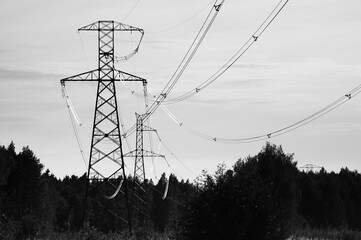 The photo shows a power line against a gray sky