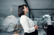 © peopleimages.com - Pregnant, business woman and thinking in office for problem solving, ideas and future planning. Maternity leave, pregnancy and tired female worker with fatigue, stressed and burnout by glass wall