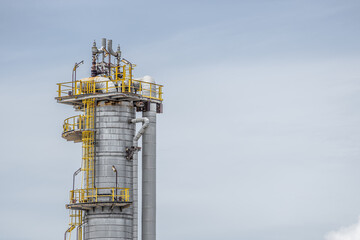 Wall Mural - Oil petroleum refinery plant building distillation columns tower, Closeup part of fuel gas pipe complex, Crude oil petrochemical industrial building.