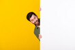 © deagreez - Photo of nice young man look empty space ad wear shirt isolated on yellow color background