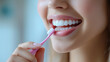 © Natalia Klenova - Woman Brushing Teeth with Pink Toothbrush
