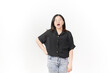 © Sino Images Studio - beautiful Asian woman strikes a sleepy pose, yawning with a tired expression against a white background