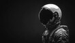 © Anastasiia - Astronaut figure in helmet stands confidently against a dark background