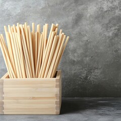 Rustic wooden box filled with bamboo straws, zero-waste store