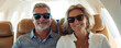 © Natalia Klenova - Happy Senior Couple Traveling Together in First Class