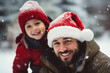 © candramawa - Happy Father and Son in Santa Hats Enjoying Winter Snow