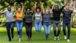 © sorin - A joyful group of friends jumping and celebrating together on a beautiful sunny day outdoors