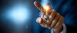 © maesarin - Finger Pointing to Glowing Lightbulb Symbolizing Smart Technology Innovation Internet of Things and Digital Transformation in the Future