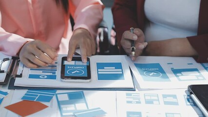 The designer team is designing the uxui system to make the uxui system work well on new phones and support system updates. Website development concept UI UX front end designer