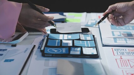 Wall Mural - the designer team is designing the uxui system to make the uxui system work well on new phones and s