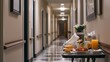 © fotofabrika - Breakfast tray with food and drink waiting outside a hotel room in a dimly lit corridor during the morning hours