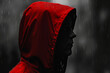 © stanhert - A mannequin wearing a red hooded jacket in the rain