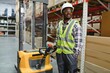 © Serhii - african american Storehouse manager supervising the lift truck operator