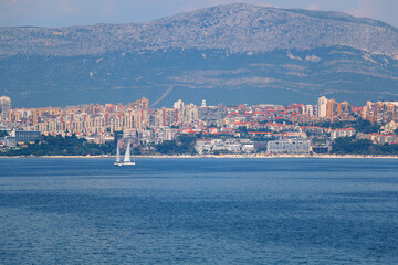 Wall Mural - Contemporary buildings, gardens and beaches at the waterfront in Split, Croatia. View of Split from the boat.