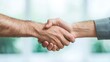 © MAY - Two businesspeople shaking hands after a successful meeting, with genuine smiles and a sense of mutual respect and accomplishment.