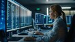 © Wolfilser - A woman works as an operator specialist in a computer data center in front of many monitors with charts and data