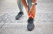 © K Davis/peopleimages.com - Ankle pain, sports and person with red glow in city for muscle sprain with running exercise. Fitness, overlay and shoes of athlete with nerve compression in leg for cardio workout or training in town