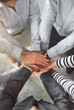 © peopleimages.com - Above, business people and hands with stack for cooperation, support and integration in office. Top view, employees and lawyers with huddle for case celebration, success and teamwork for partnership