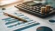© Juan - Financial report analysis with calculator and pen on charts