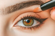 © Mayava - Close-up image of a woman's eye being applied makeup, suitable for beauty and cosmetic industry