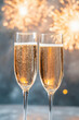 © IndigoElf - Two glasses of sparkling champagne on the table against a backdrop of fireworks exploding in the sky. New Year Eve party, holiday celebration