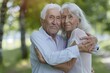 © darshika - Happy elderly couple in park with good health and relationship.