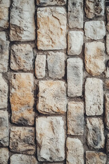 Vertical Masonry Rock Wall Texture. Part of old castle stone wall background.