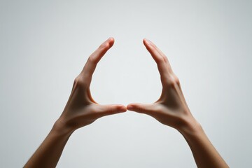 Aufkleber - Image of two hands in a circular form against a blank backdrop, symbolizing creativity and unity, highlighting human expressions through shadow play techniques.