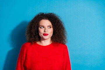 Photo portrait of attractive young woman look empty space dressed stylish red clothes isolated on blue color background