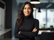 © Natawut - Professional Indian woman with crossed arms wearing a formal shirt
