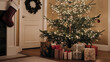 © MatandSterre - Cozy living room featuring a beautifully lit Christmas tree adorned with ornaments, surrounded by colorful wrapped gifts and a festive stocking hanging nearby.