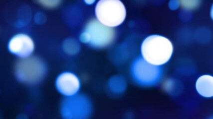 Glowing blue bokeh lights moving 4k animation seamless loop with glow. Blur and round glowing and blinking lights backdrop