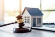 © matoya - Gavel, House Model, and Laptop on a Table