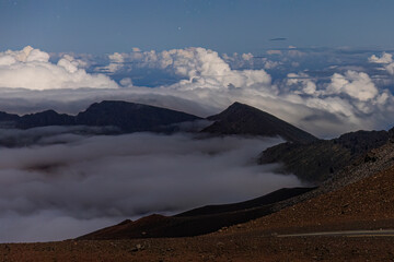Wall Mural - landscape view at night with stars at the top of haleakala national park in hawaii.