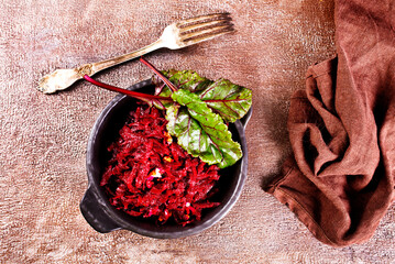 Wall Mural - Beetroot salad with wallnuts and garlic in bowl