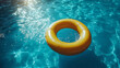 © Your Hand Please - Description: A colorful inflatable ring floats peacefully on a calm blue pool, symbolizing relaxation, carefree moments, and the playful spirit of summer. Ideal for vacation and leisure imagery