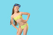 © Pixel-Shot - Cute little happy girl in swimsuit with snorkeling mask on blue background