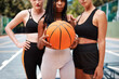 © peopleimages.com - Women, hands and court with basketball for sport, game or outdoor match for challenge or competition. Active, female people or young players ready with ball or team for training, practice or exercise