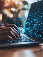 Close-up of hands typing on a laptop keyboard with glowing blue code on the screen.