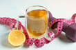 © Pixel-Shot - Cup of diet tea, lemon, measuring tape and dumbbell on light color background. Weight loss concept