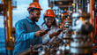 © Antto-AI - Young diverse engineers smiling while using smartphones in industrial setting