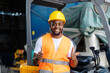 © dusanpetkovic1 - Portrait of smiling black industrial worker in protective work wear giving thumbs up at the camera.