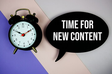 time for new content text on speech bubble with alarm clock top view on purple geometric background