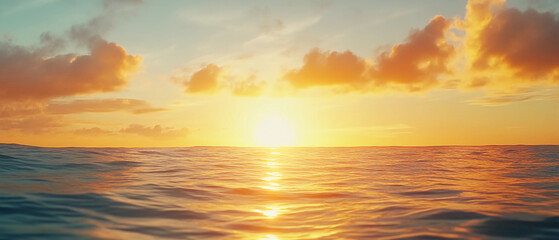 Wall Mural - Golden ocean sunset with vibrant clouds and sunlight reflecting on gentle waves, capturing the warmth and tranquility of dusk.