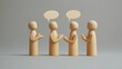 © ryker - Wooden human figures stand in row, engaging in conversation with speech bubbles, symbolizing communication and interaction
