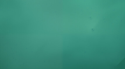 Wall Mural - soft teal abstract background with subtle spots and calming gradients